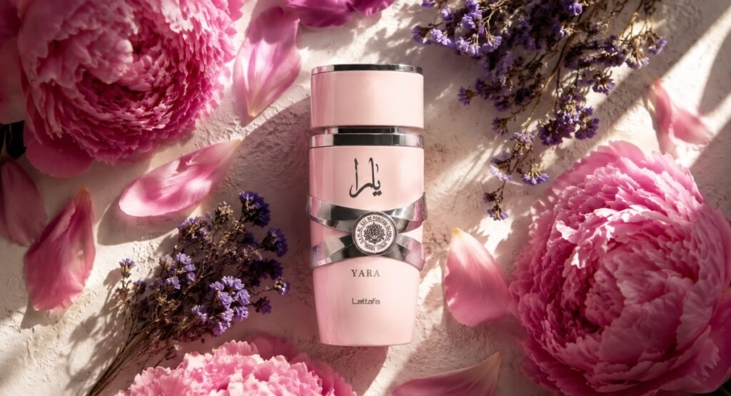 Lattafa Yara EDP bottle surrounded by pink flowers and soft lighting editorial flatlay