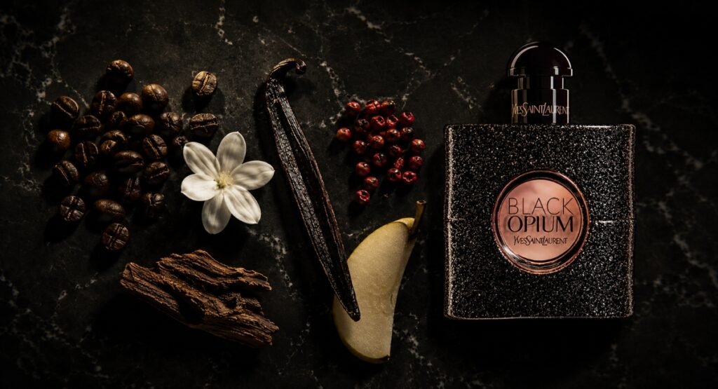YSL Black Opium EDP fragrance notes coffee vanilla jasmine dark flat lay
